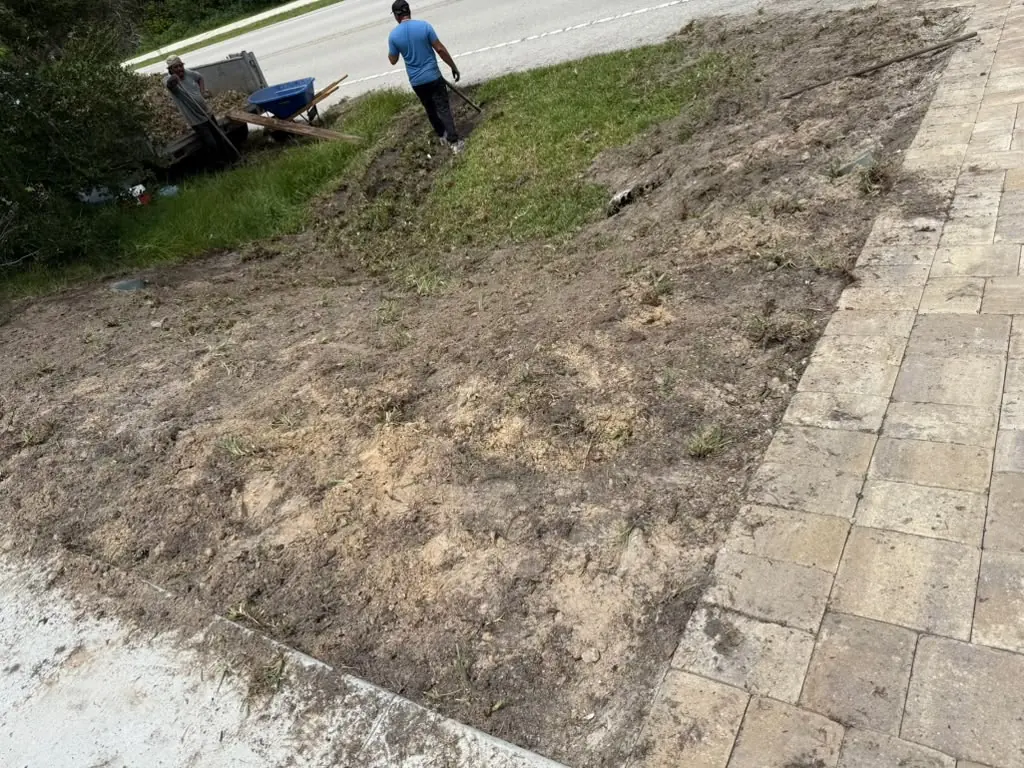 Gomez crew preparing a lawn area for new sod