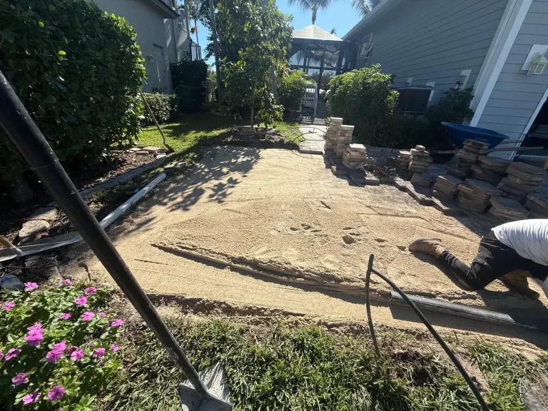 Gomez Landscaping crew preparing a yard for paver installation