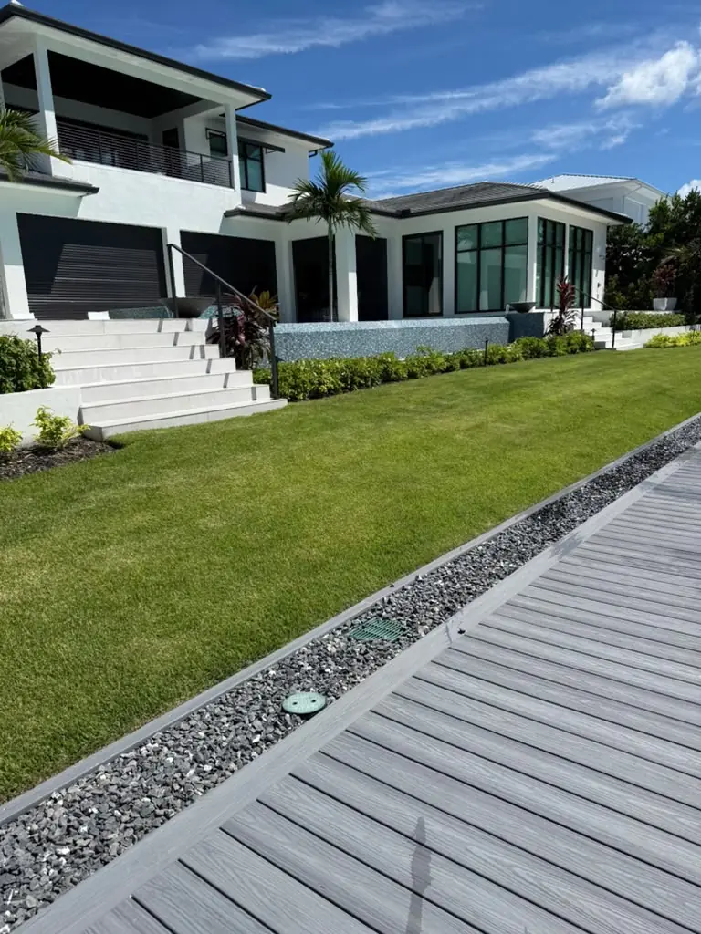 Manicured lawn at a modern waterfront home