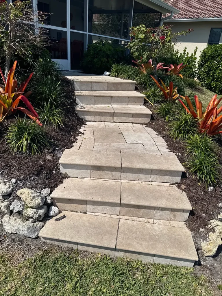 Paver steps lined with tropical plantings