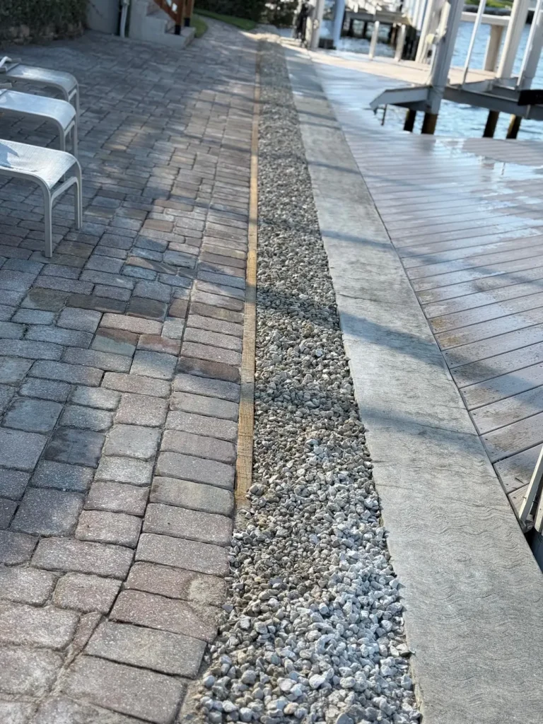 Pressure washed pavers and rock border